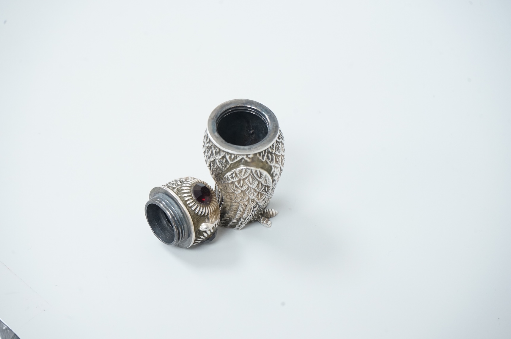 A novelty silver plated condiment, modelled as an owl, with two faceted glass eyes, height 66mm.